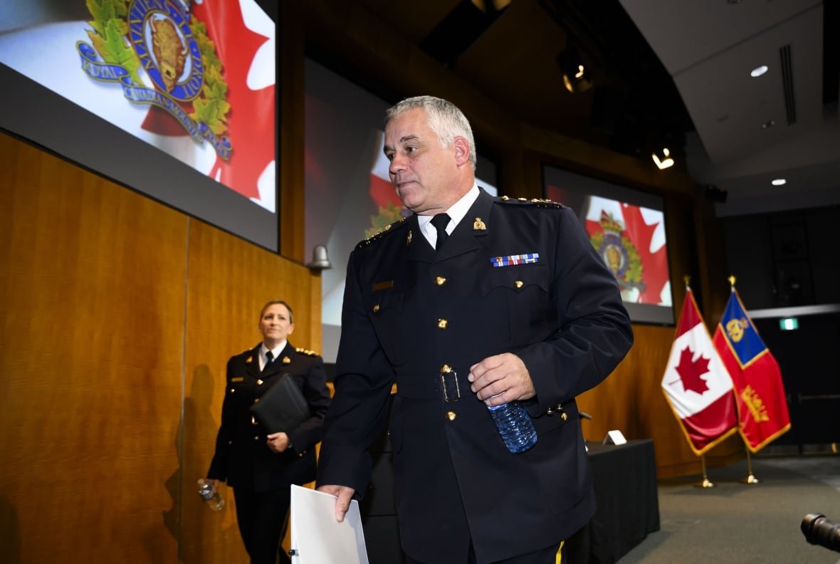 RCMP Commissioner Mike Duheme, centre, and Assistant Commissioner Brigitte Gauvin leave a press conference on Monday, Oct. 14, 2024 after accusing agents of the Indian government of playing a role in 'widespread violence' in Canada.