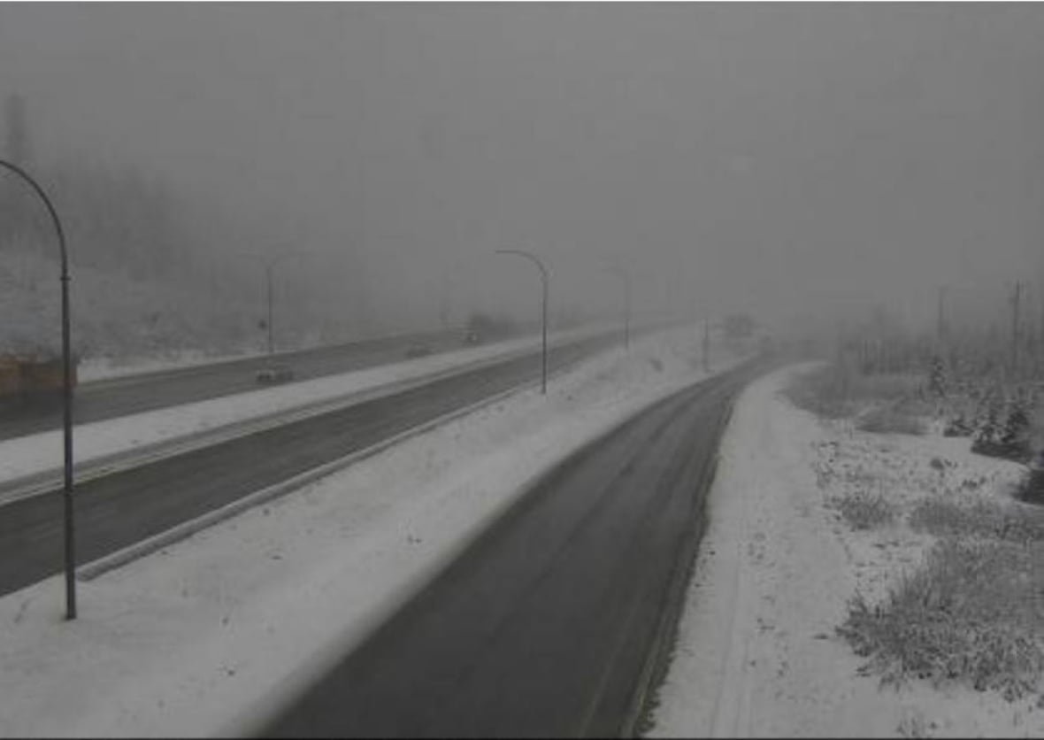 A snowy stretch of highway.