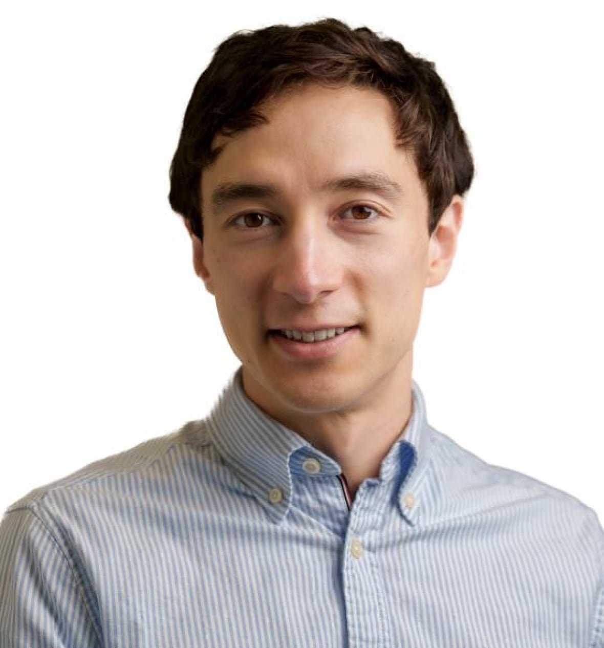 Man with a stripped dress shirt and brown hair.