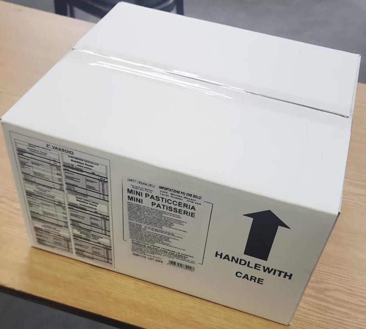 A white box seen from above, with the words 'Handle with care.'