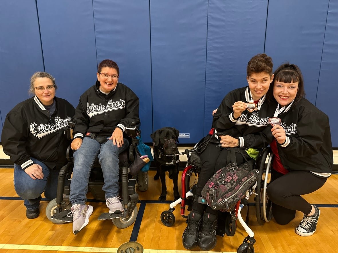 Puri and McLeod sit next to their performance partners, Tracey Carvell, far left, and Lorna McKenzie, far right.